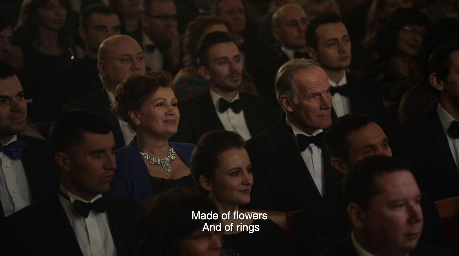 a large group of people wearing tuxedos