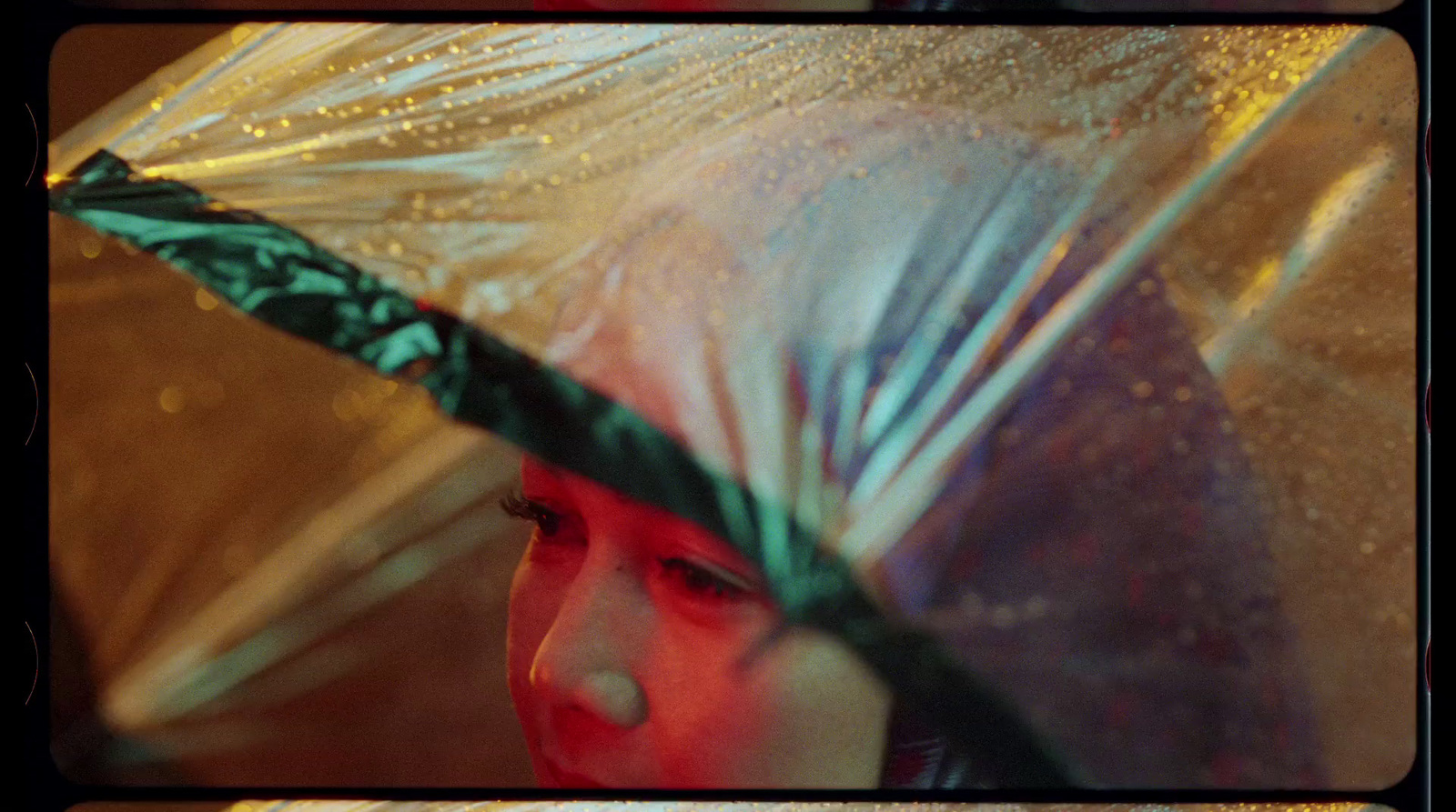 a woman holding an umbrella in the rain