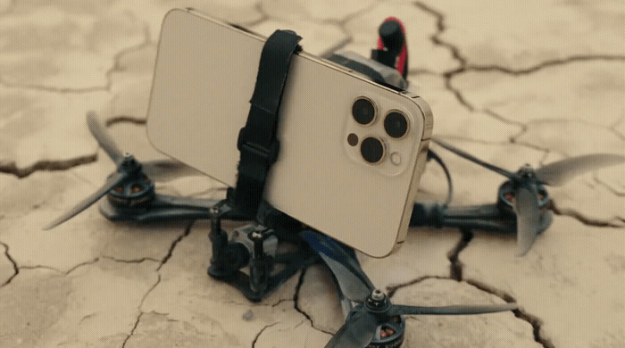 a close up of a cell phone with a camera attached to it