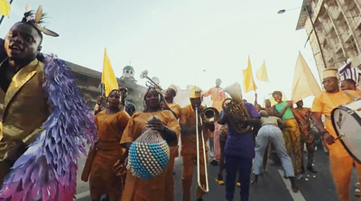 a group of people marching down a street