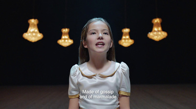 a young girl standing in front of a group of lights