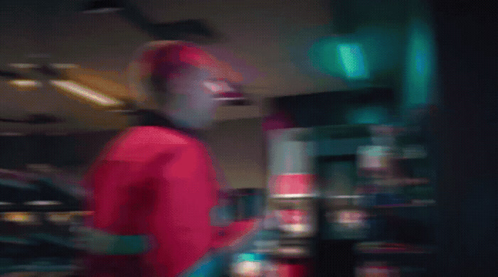 a blurry photo of a man in a red jacket