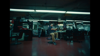 a man sitting in a chair in a room