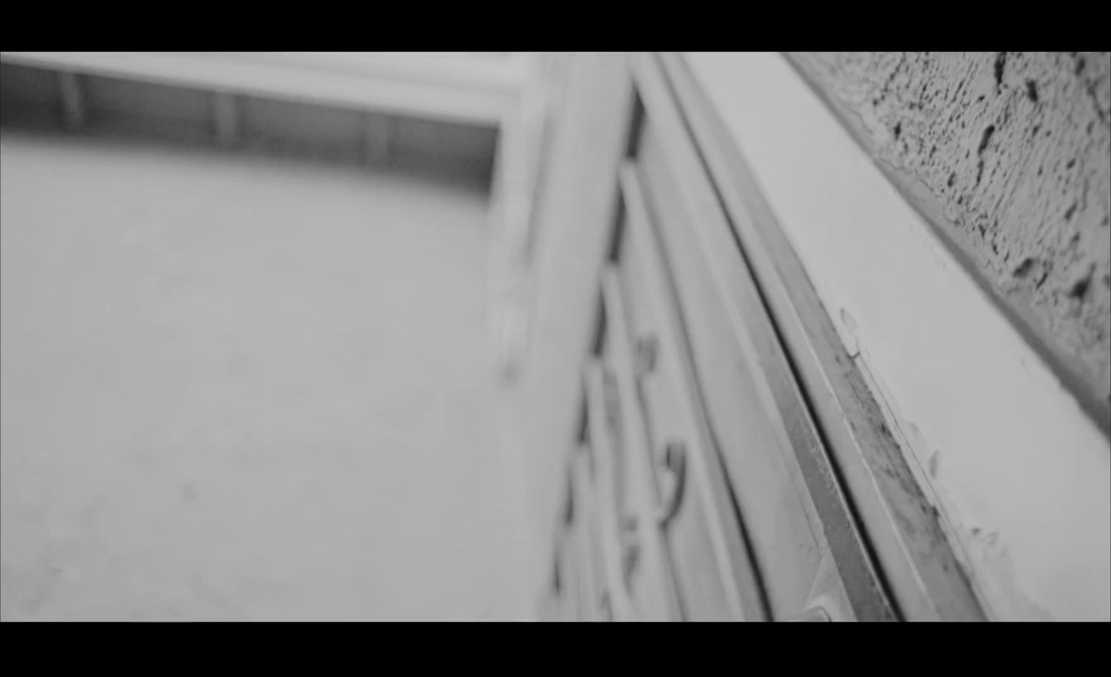 a black and white photo of a window sill