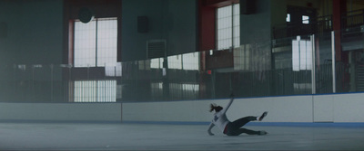 a person on a skateboard on an ice rink