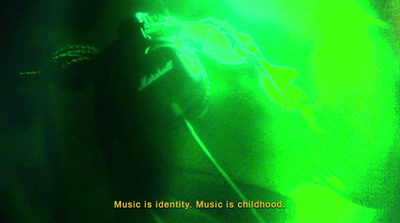 a person with headphones in a dark room