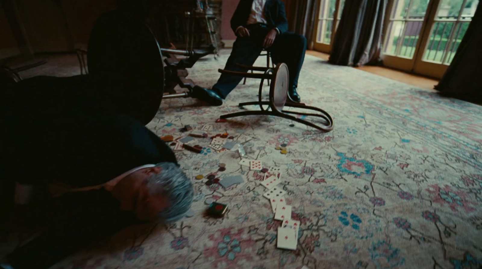 a man sitting in a chair in a living room