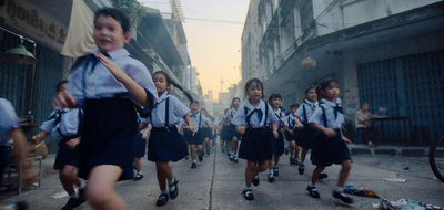 a group of school girls walking down a street