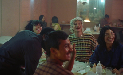 a group of people sitting around a table