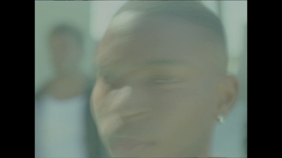 a blurry photo of a man's face in front of a mirror