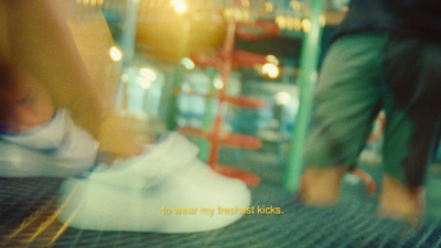 a close up of a person's shoes on a conveyor belt