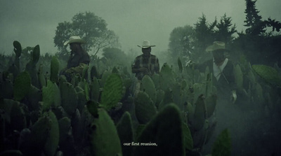 a group of men standing next to each other in a field