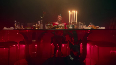 a man sitting at a table with candles on it