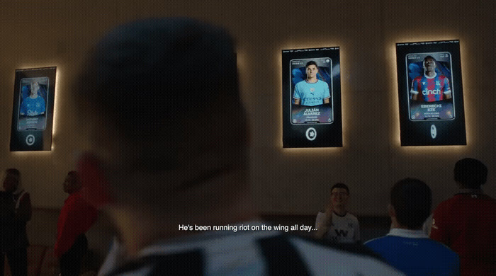 a man standing in front of a group of cell phones