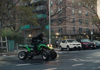 a person riding a motorcycle on a city street