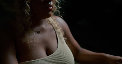 a close up of a person wearing a tank top