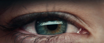 a close up of a person's blue eye