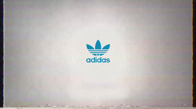 a white wall with a blue adidas logo on it