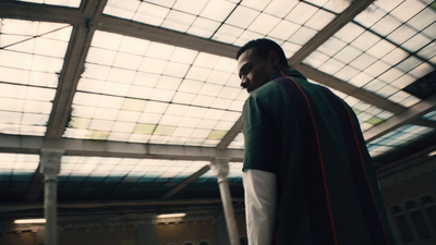 a man dressed in a priest's outfit standing in a building