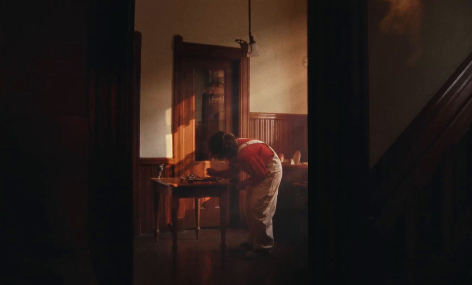 a man standing at a table in a room