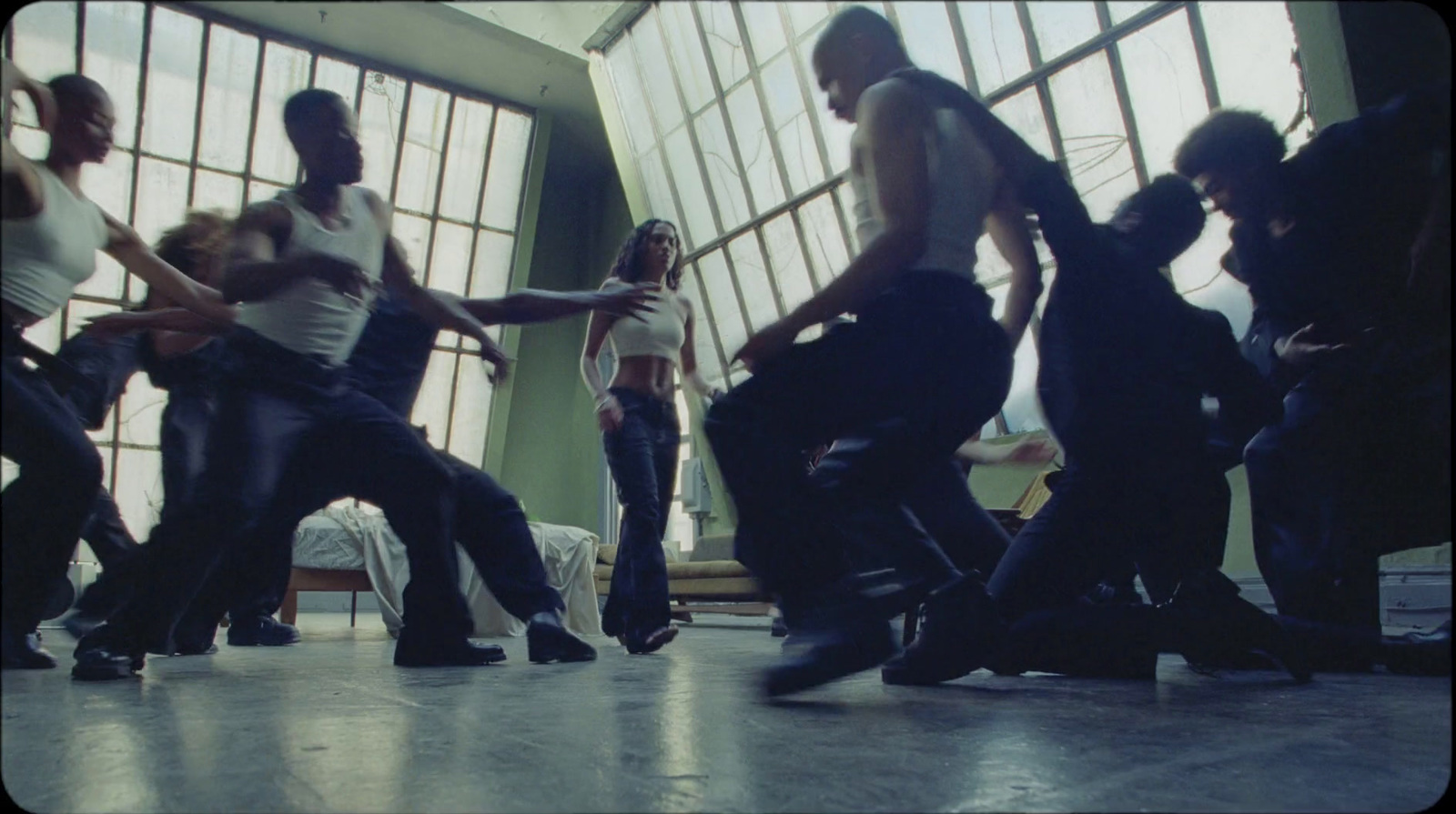 a group of people dancing in a room