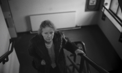 a woman walking down a flight of stairs