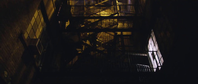 a staircase in a building lit up at night