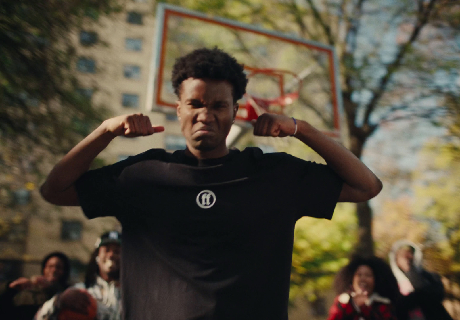 a man standing in front of a basketball hoop