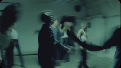 a blurry photo of a group of people dancing