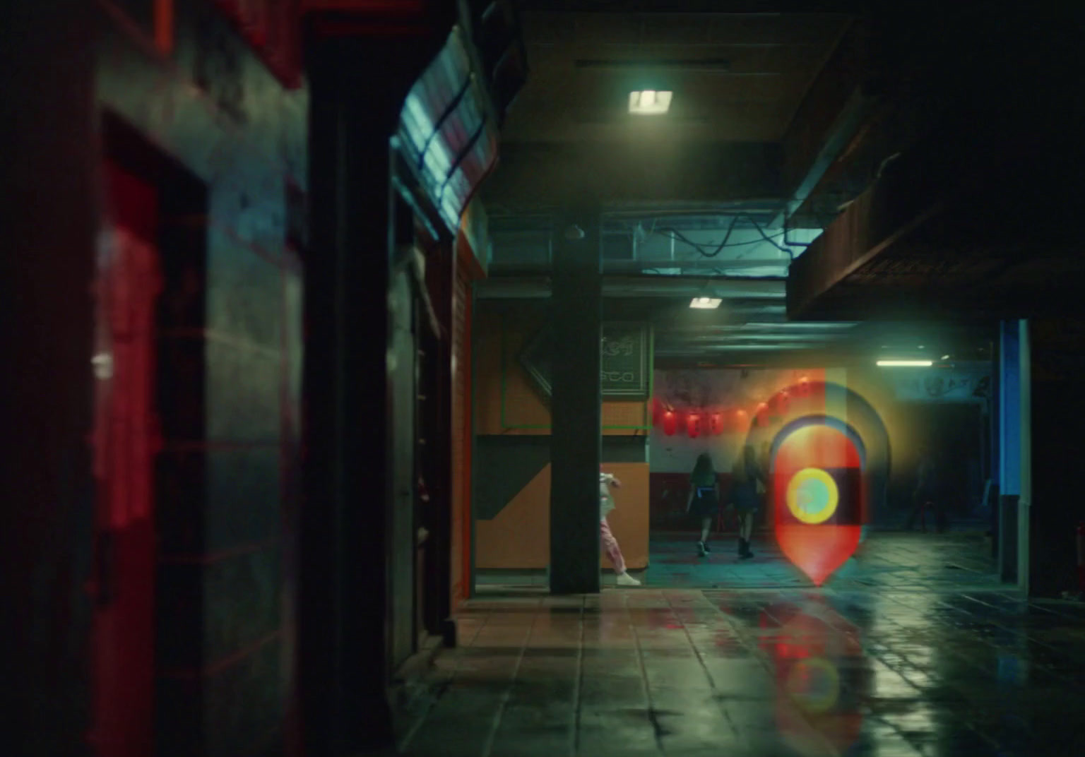 a dark hallway with a red and yellow target in the center