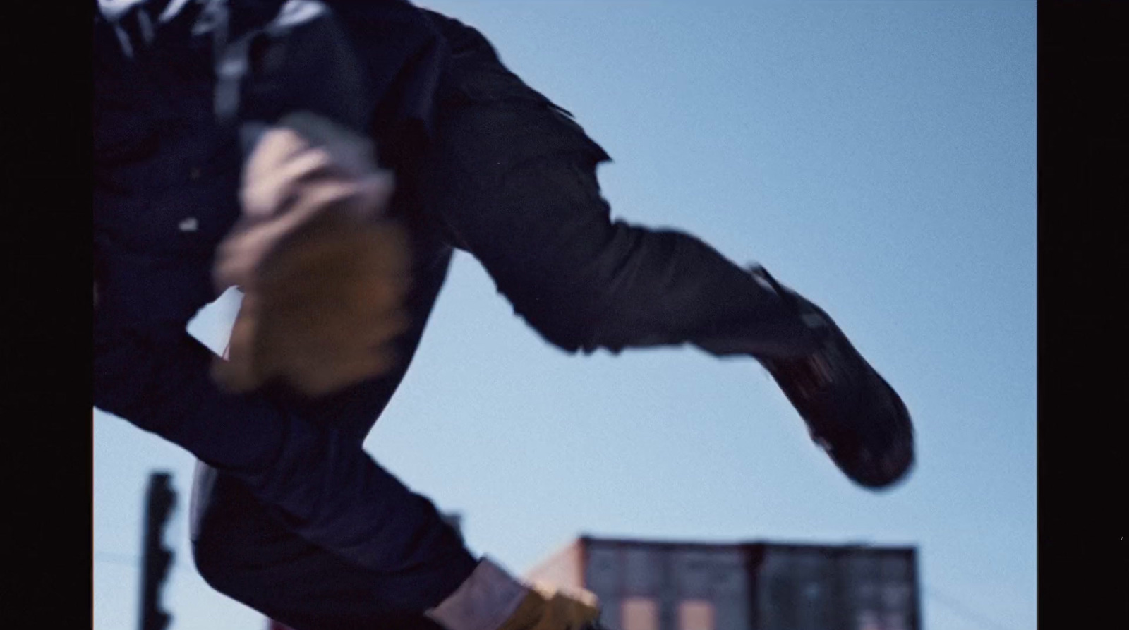 a man flying through the air while riding a skateboard