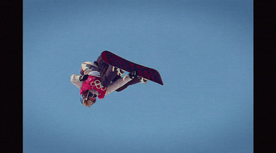 a person on a snowboard in the air