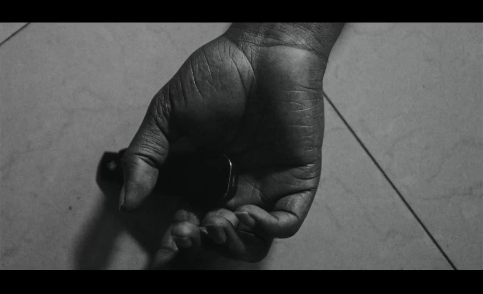 a black and white photo of a person's hand