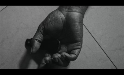 a black and white photo of a person's hand