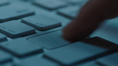 a close up of a person typing on a keyboard