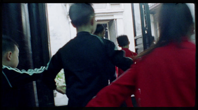 a group of people standing outside of a building