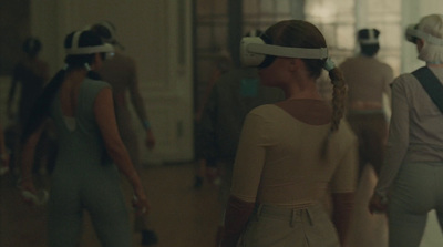 a group of people wearing virtual headsets in a room