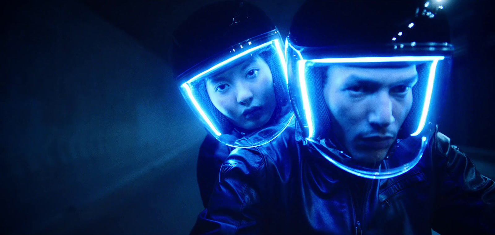 a man and a woman with neon lights on their faces