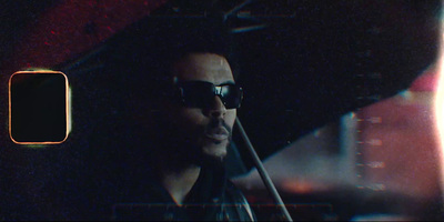 a man with sunglasses playing a violin