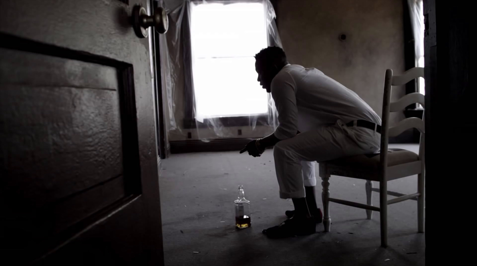 a man sitting on a chair in a room