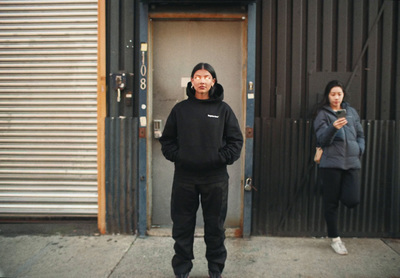 a man and a woman standing in front of a door