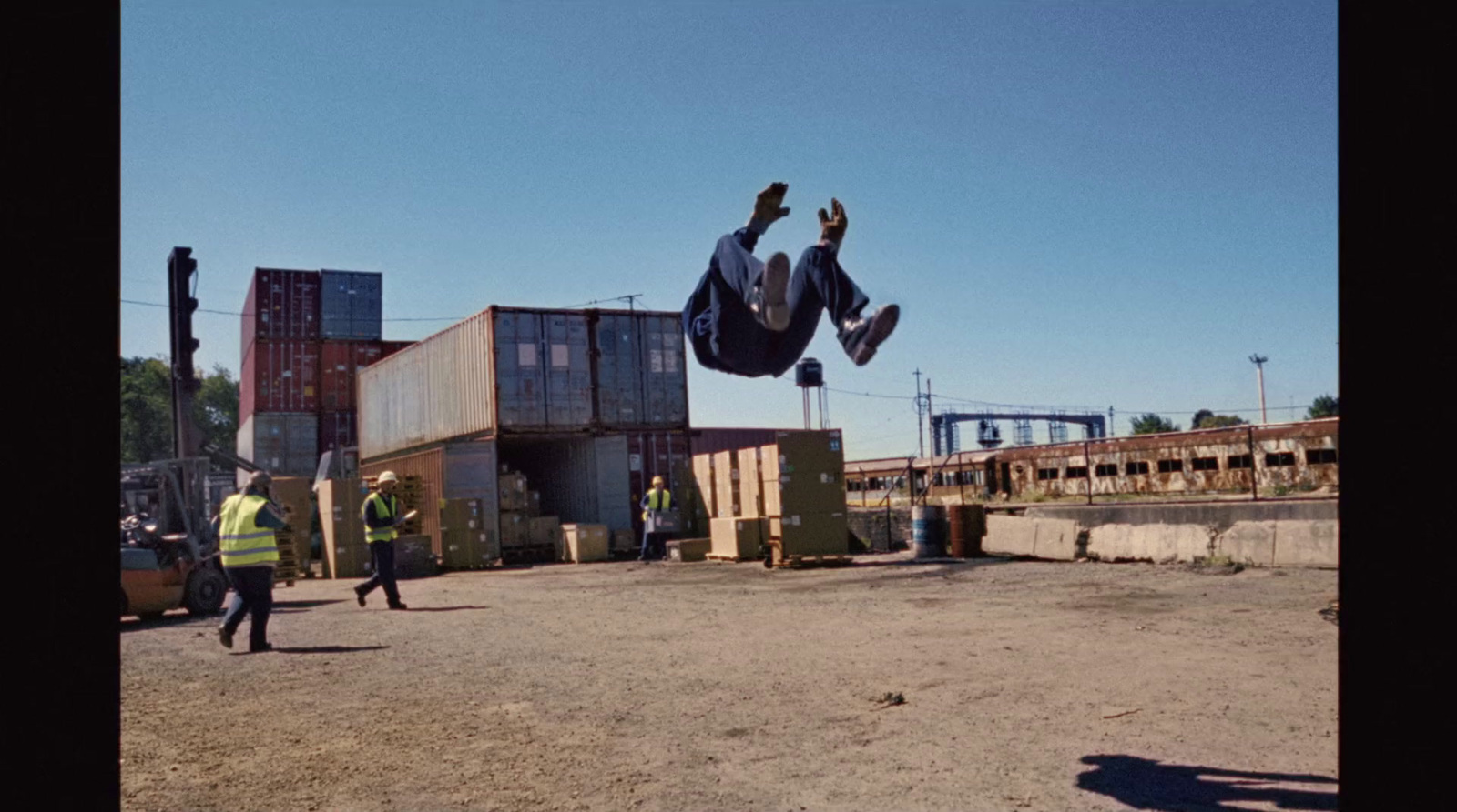 a man flying through the air while riding a skateboard