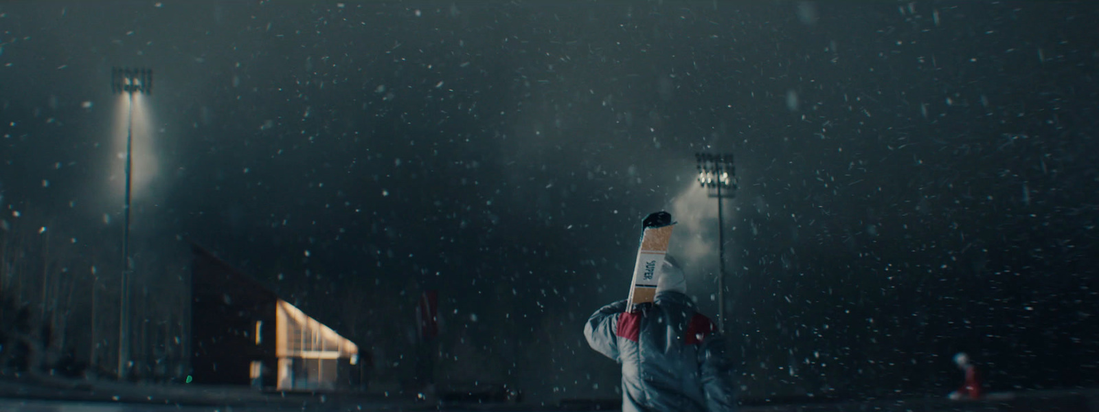 a person holding a baseball bat in the rain