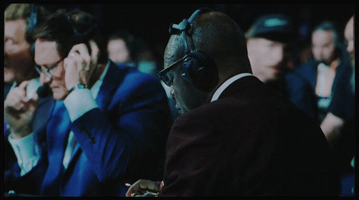 a group of men sitting next to each other