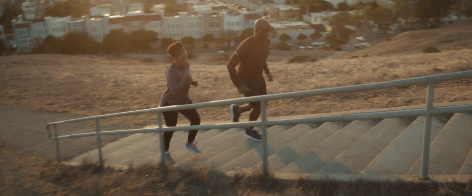 a couple of people that are walking up some stairs