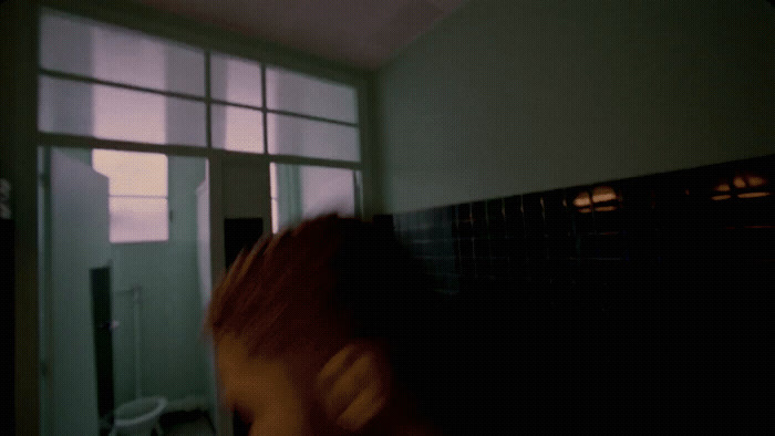 a blurry photo of a person in a bathroom