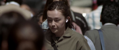 a woman with ear buds on her ears