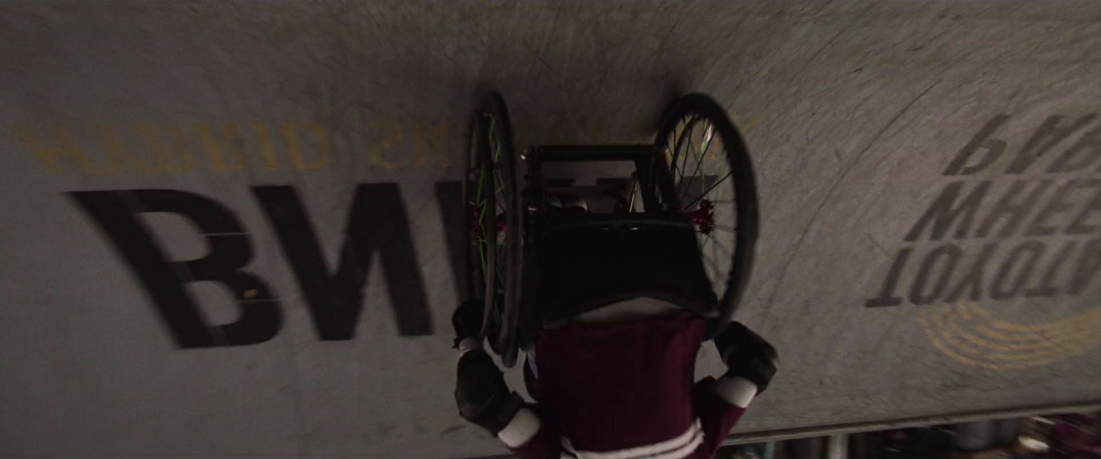 a person riding a bike on top of a ramp