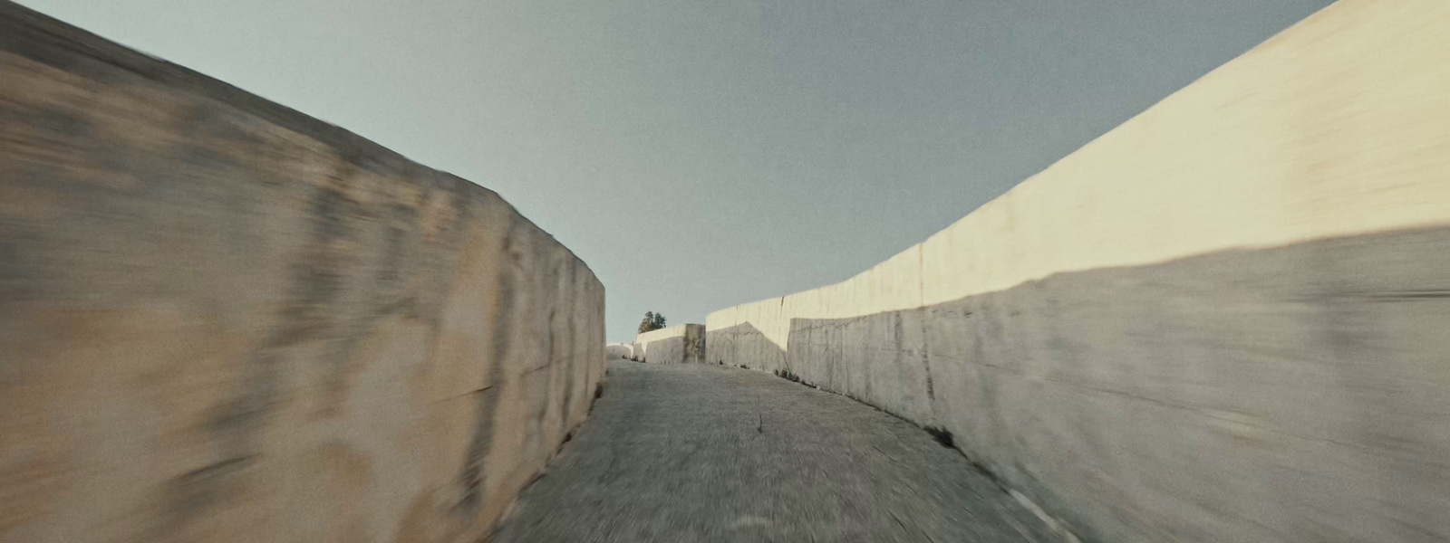 a person riding a skateboard down a street