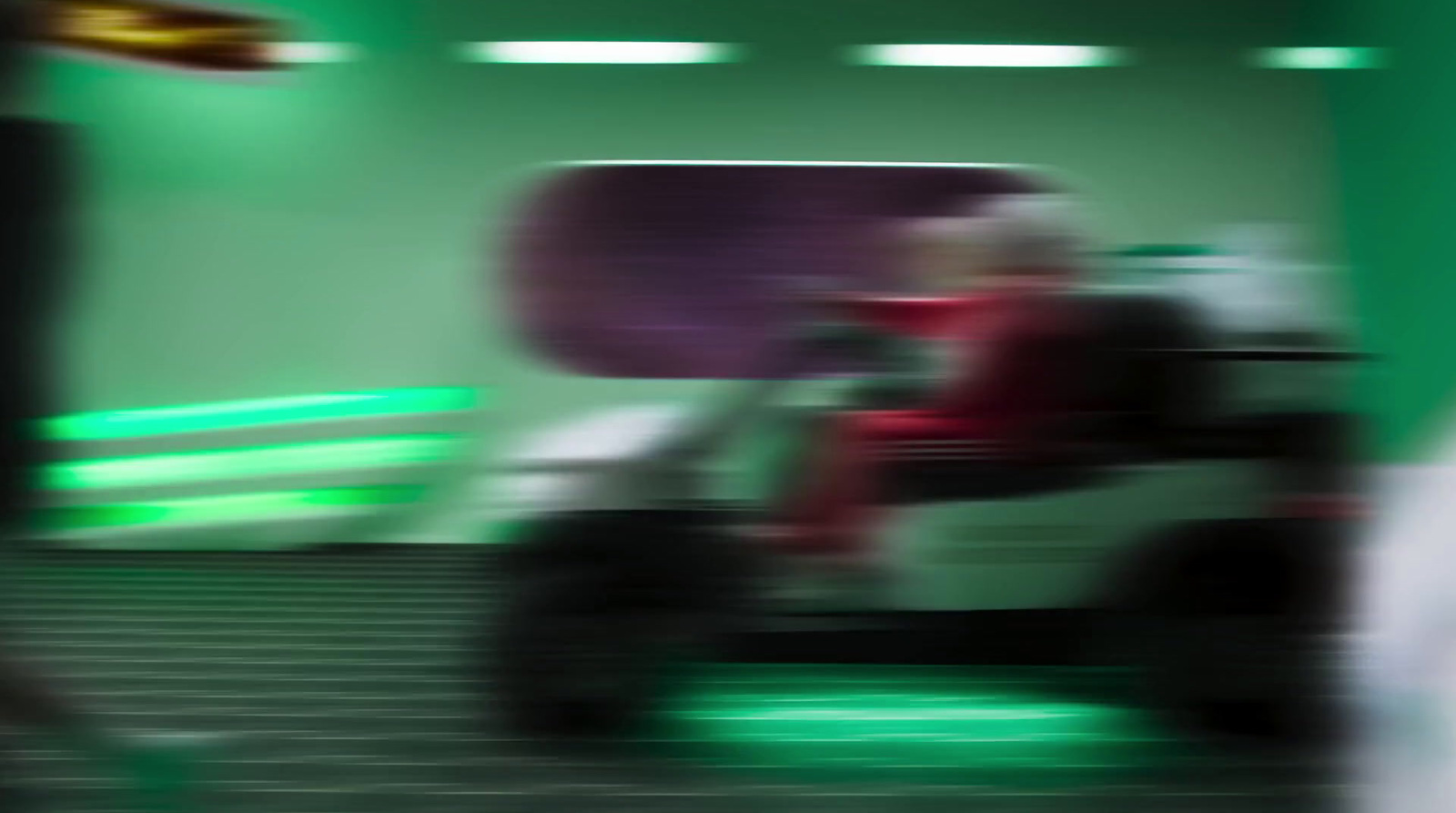 a blurry photo of a person on a scooter